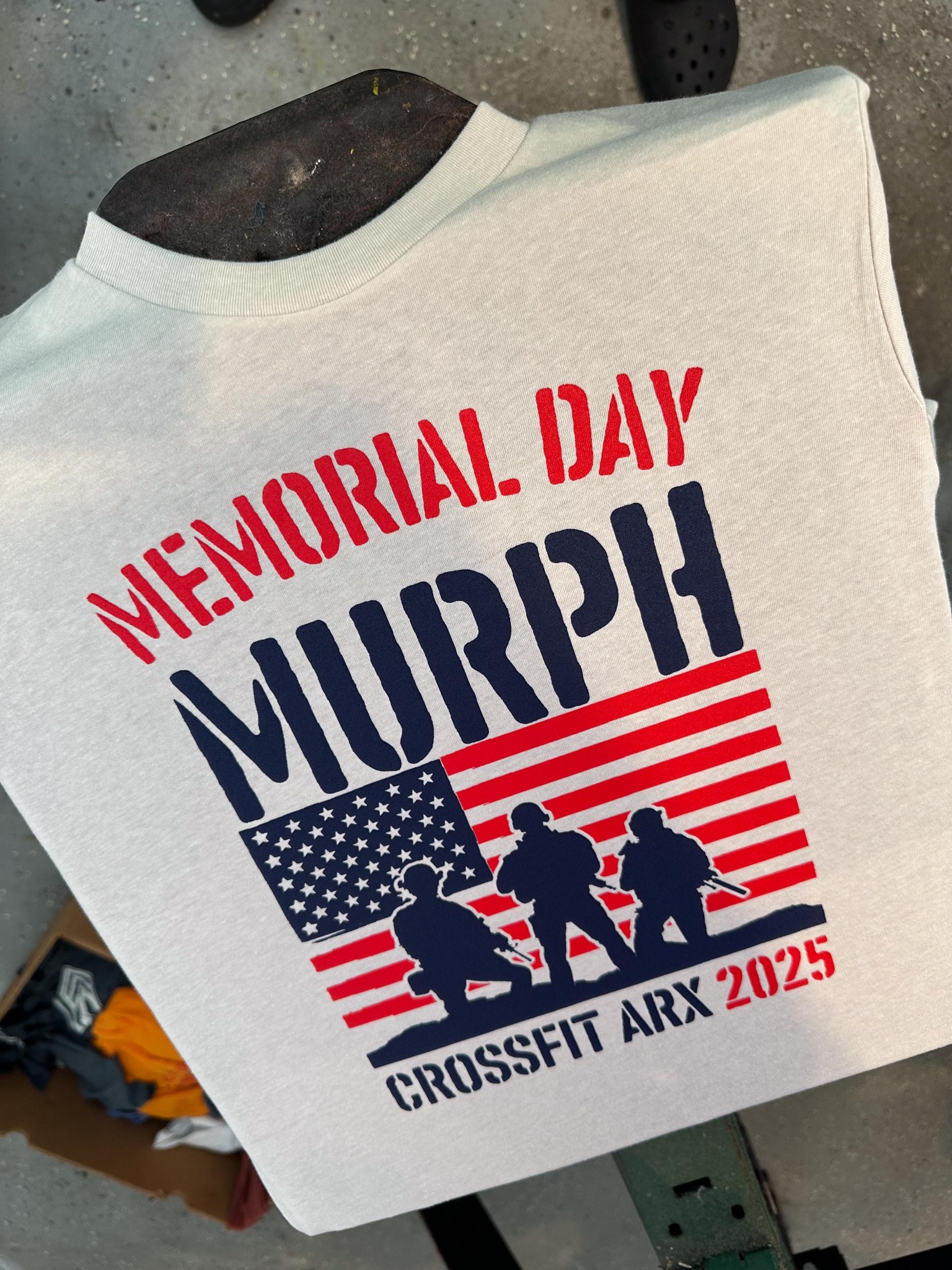 Red and navy Memorial Day Murph 2025 design on a light CrossFit ARX shirt